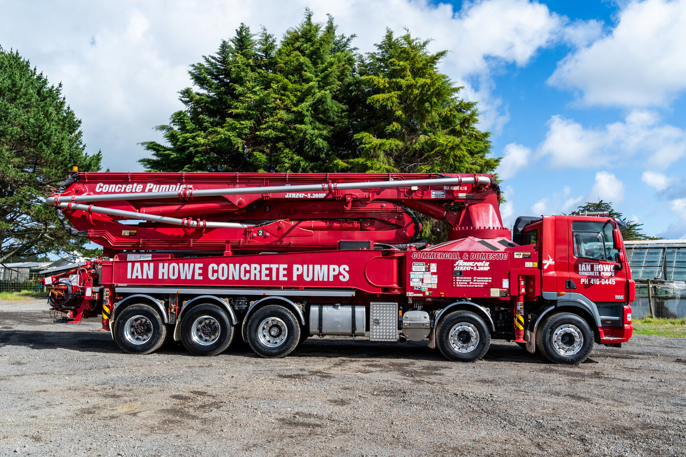 Concrete pump truck placing concrete at a hillside job site near Asheville, NC