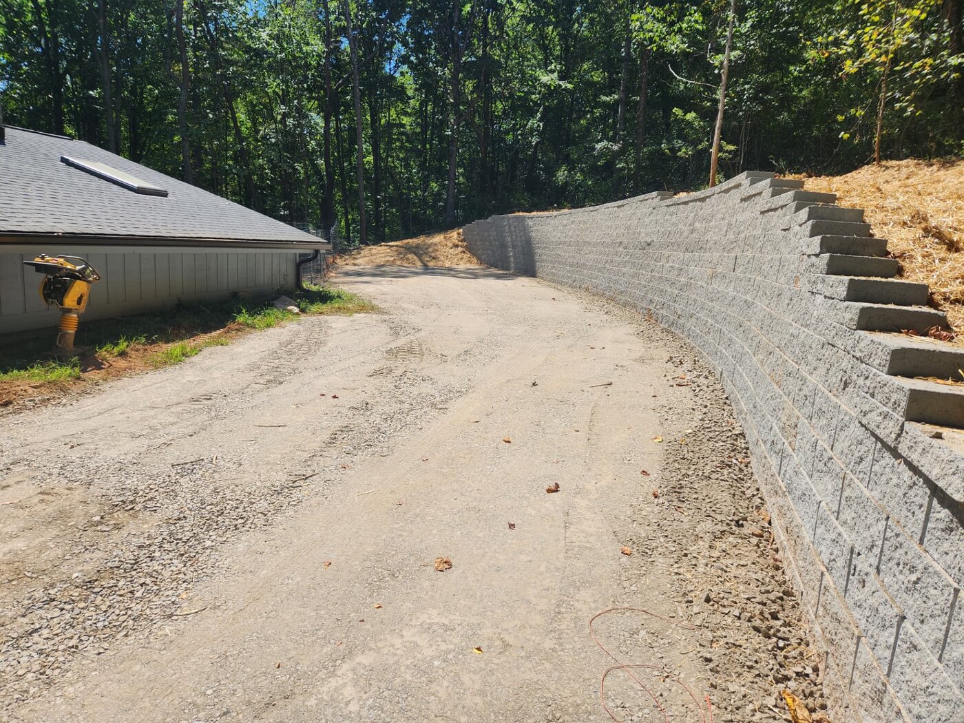 Block retaining wall terracing a sloped yard near Asheville, NC